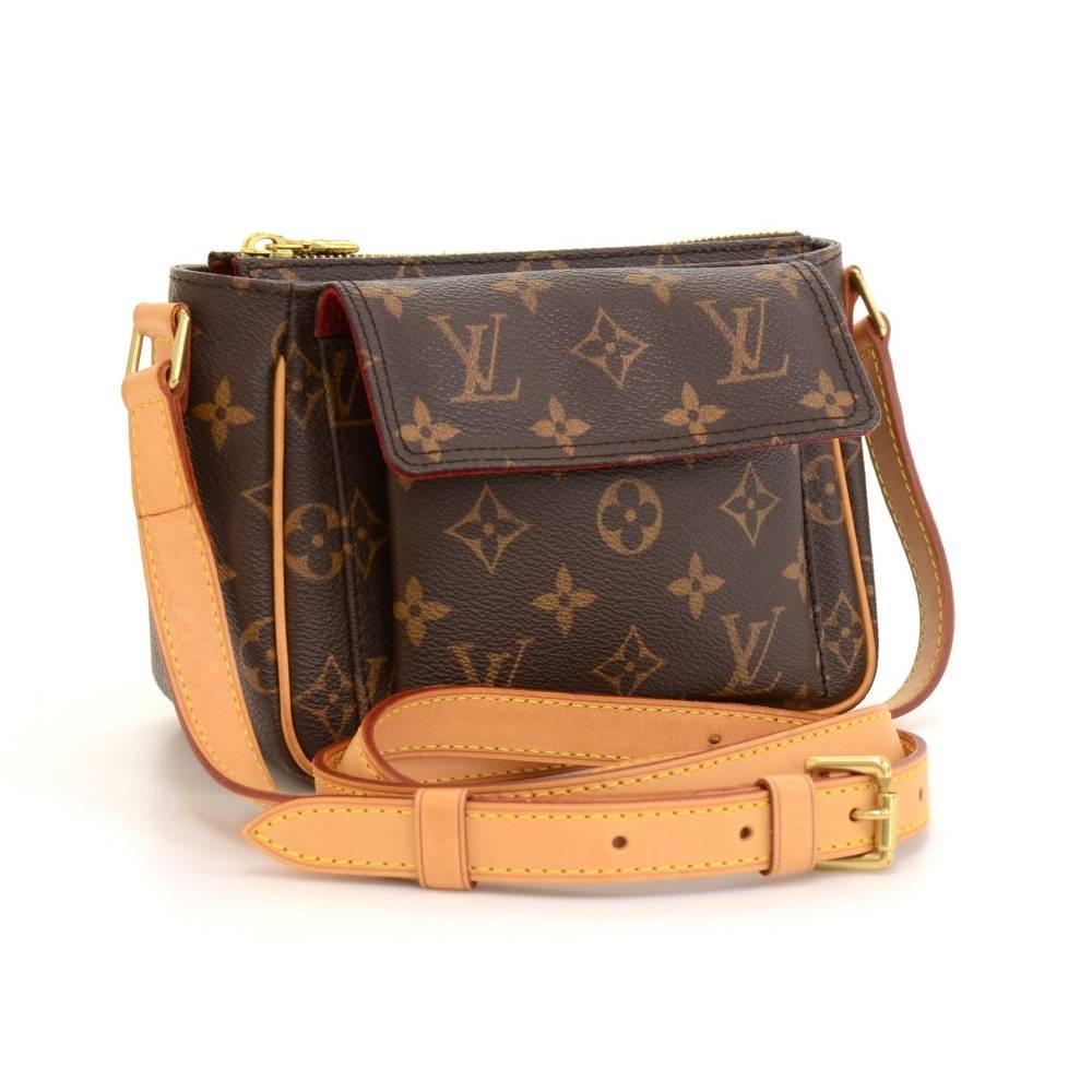 Louis Vuitton Viva Cite bag in monogram canvas. Outside has 1 flap pocket with magnetic closures. Main access is secured with zipper. Inside has red alkantra lining. Comfortably carry on shoulder or across the body with cowhide adjustable shoulder