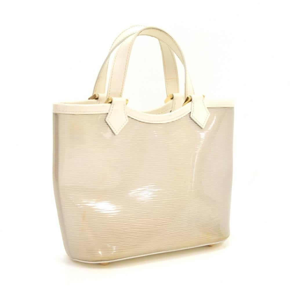 Louis Vuitton white vinyl mini Lagoon beach bag. It is from the limited collection from the years 2003. It has string closure and fabric lining. Extremely rare bag to find.

Made in: Spain
Serial Number: CA0012
Size: 9.4 x 8.1 x 4.3 inches or 24