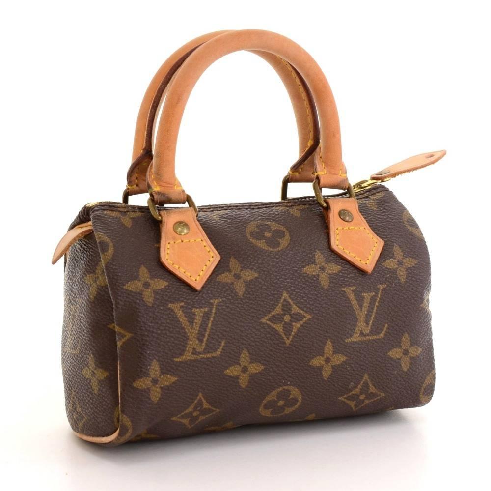 Louis Vuitton handbag Mini Speedy Sac HL, one of the most popular line in LV monogram canvas. Brass zipper securing access. Inside is brown lining. Very cute item to have. 

Made in: France
Serial Number: T H 0 9 1 3
Size: 5.9 x 3.9 x 2.8 inches