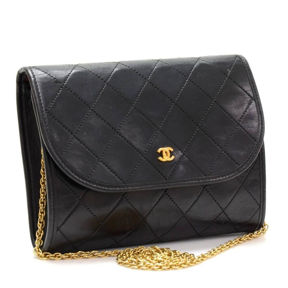 Chanel black quilted leather mini bag. It has flap and CC stud lock on the front. Inside has Chanel red textile lining. It can be used as shoulder bag or clutch.

Made in: France
Serial Number: Hard to read
Size: 6.7 x 5.1 x 1.4 inches or 17 x