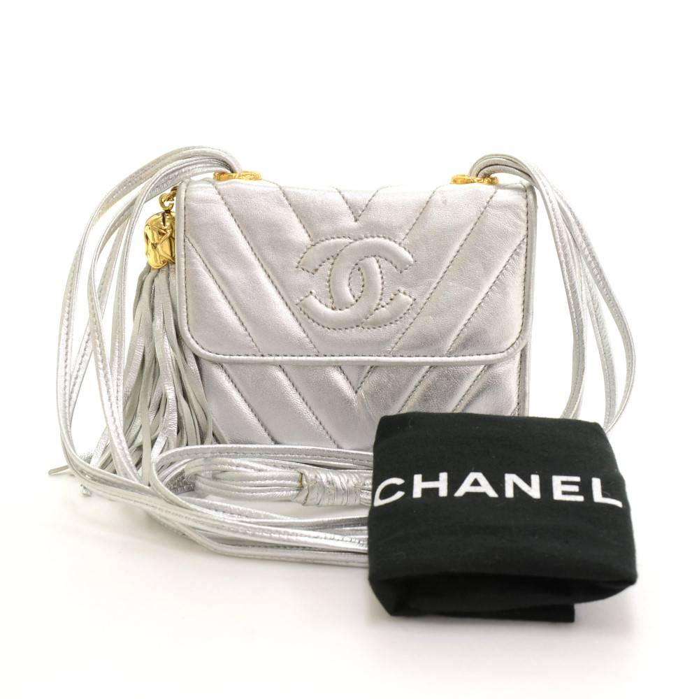 Chanel mini shoulder flap shoulder bag in silver metallic quilted leather. It has flap with magnetic closure in front. Inside has matching leather lining and 1 zipper pocket. Perfect for your night out 

Made in: France
Serial Number: