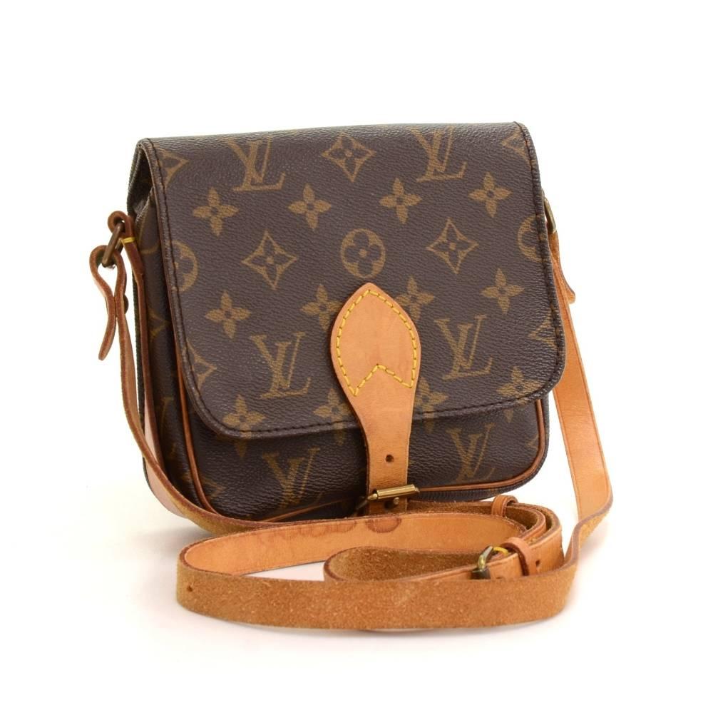 Louis Vuitton Cartouchiere PM in monogram canvas. Flap top secured with belt closure. Inside is brown washable lining. Comfortably carry on shoulder or across body with cowhide leather strap. 

Made in: France
Serial Number: 8 9 0 6 S L
Size: