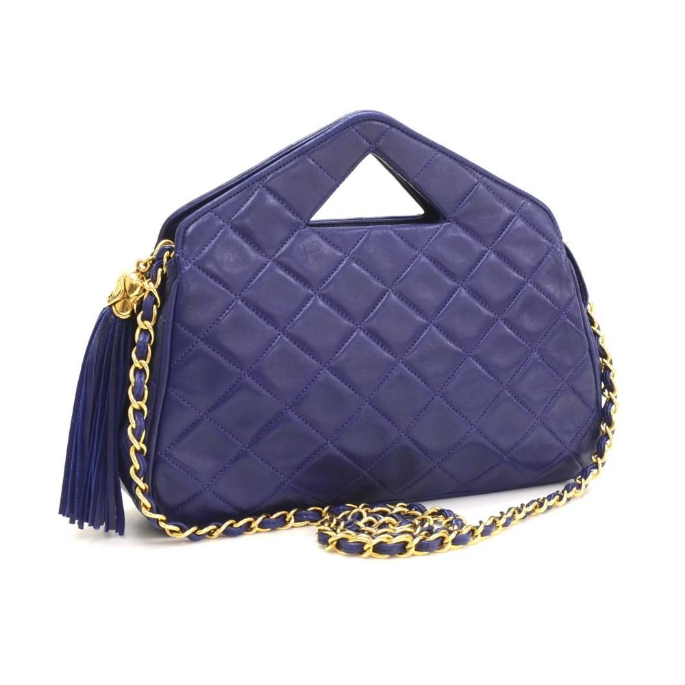 Chanel Navy quilted leather shoulder bag. Top is secured zipper with a fringe attached zipper pull. Inside is in black leather lining and 1 zipper pocket. Ready for any occasion. 

Made in: Italy
Serial Number: 1313103
Size: 9.8 x 5.9 x 2.4