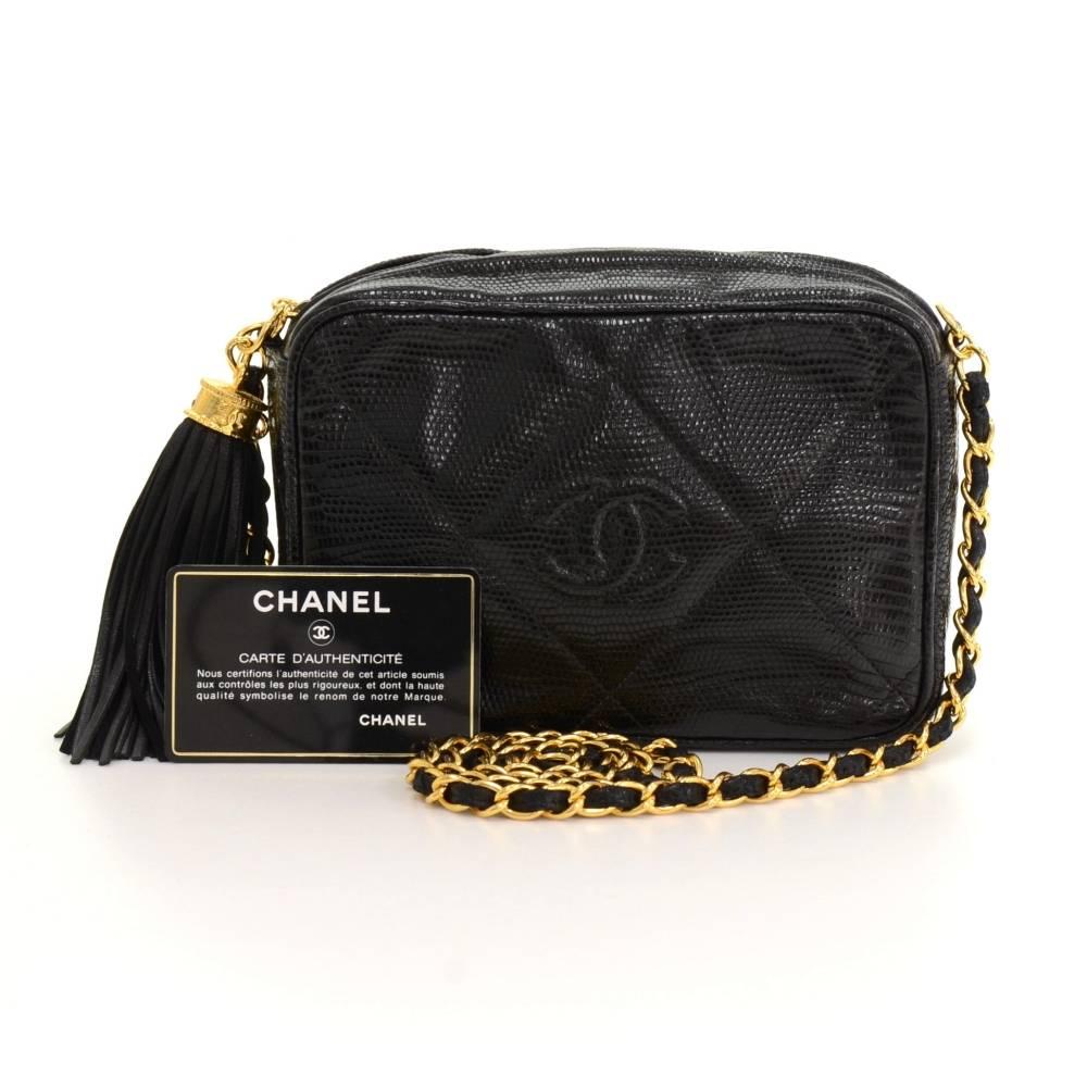 Chanel black lizard quilted leather shoulder bag. Top is secured zipper with a fringe attached zipper pull. Inside is in black leather lining and 1 zipper pocket. Ready for any occasion. 

Made in: Italy
Serial Number: 0874273
Size: 6.9 x 4.7 x