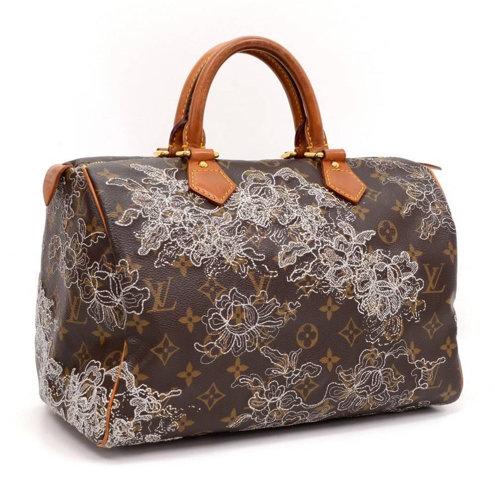 Louis Vuitton Speedy 30 hand bag crafted in monogram dentelle. It is 2007 limited edition. Inspired by the famous keep all travel bag, it features a brass zip closure. Perfect for carrying everyday essentials.

Made in: France
Serial Number: S P