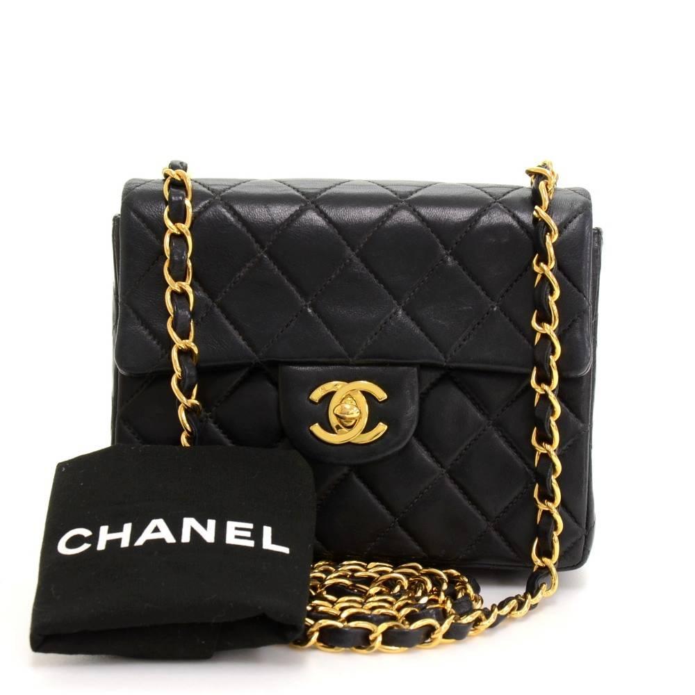 Chanel black quilted leather mini bag. It has flap and CC twist lock on the front and open slip in pocket on the back. Inside has Chanel red leather lining and 2 pockets; 1 zipper and 1 open. It can be used as shoulder bag or across the