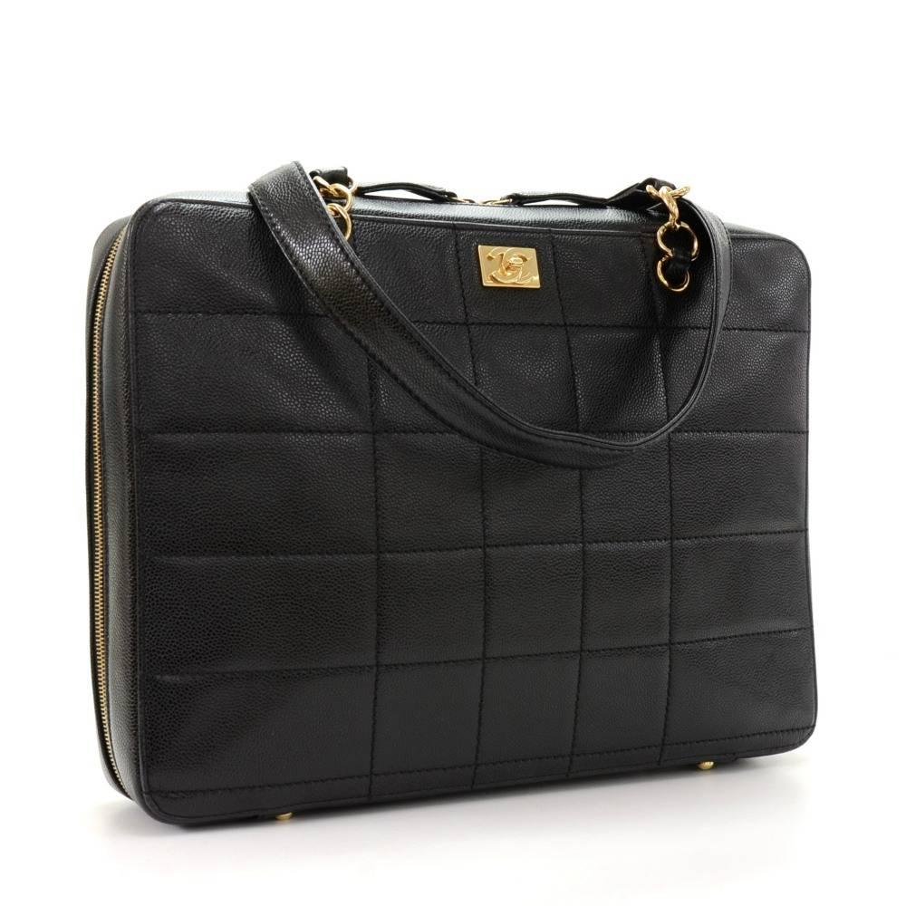 Chanel black caviar quilted leather shoulder business bag. It has double zipper closure on top and 1 slip in pocket with sutd closure in the back. Inside is in black nylon lining and 2 pockets. Leather strap can be carried as shoulder bag. Very