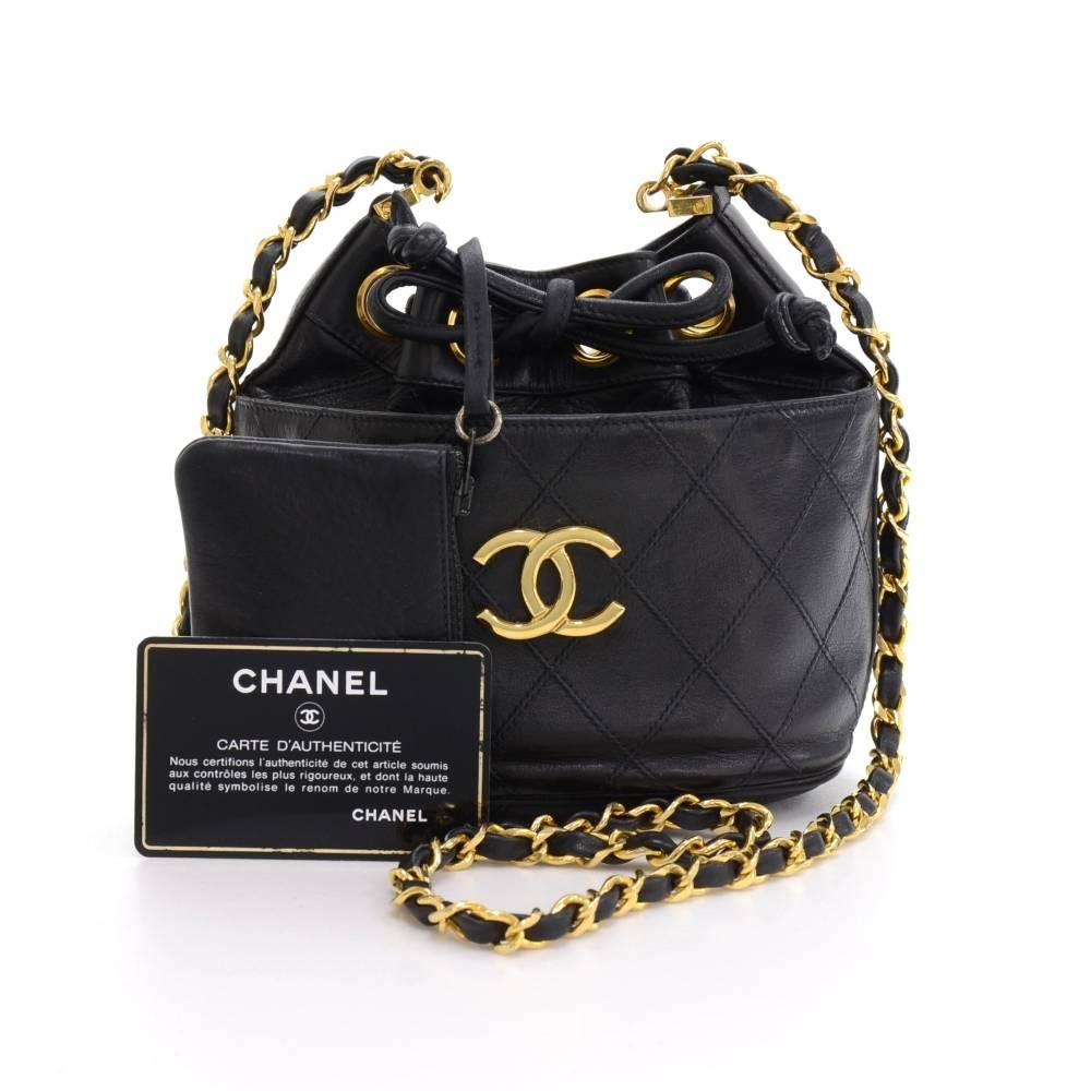 Chanel black quilted leather mini bucket bag. Top secured with leather string. Inside has black leather lining with 1 attached case. It can be used as shoulder bag.

Made in: Italy
Serial Number: 0822100
Size: 6.3 x 6.3 x 4.3 inches or 16 x 16 x
