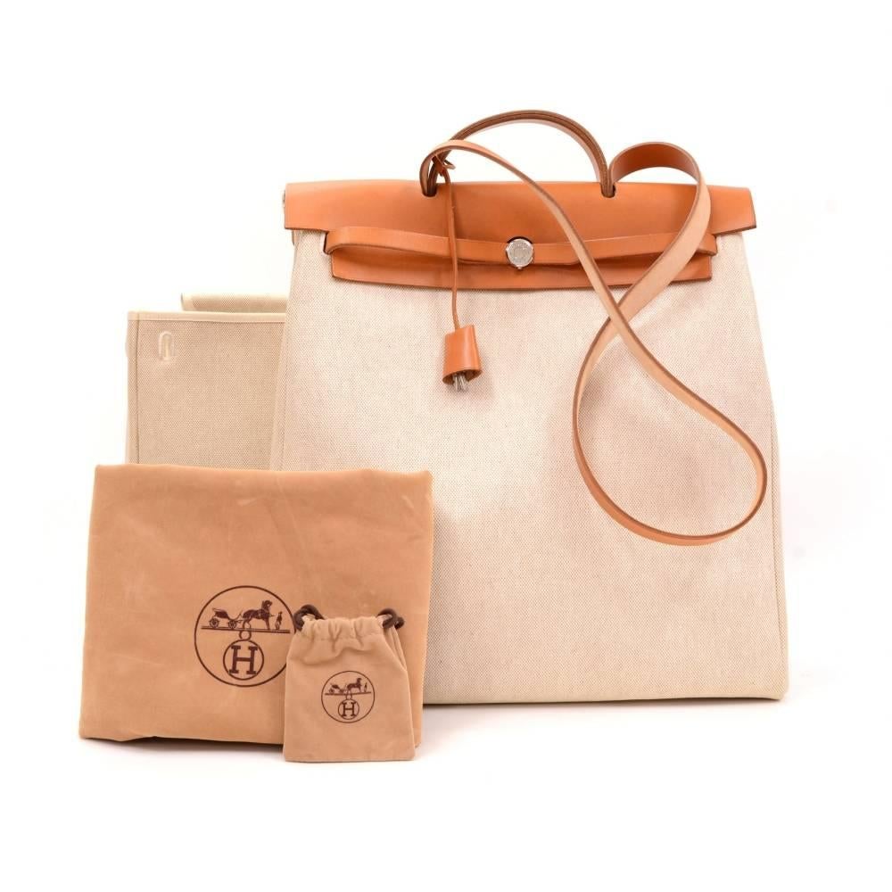 Hermes HerBag MM size 2 in 1. Two canvas bags with leather. Leather pieces can be attached to both bags so you can enjoy different looks. Very stylish bag. Tall Canvas bag: App 15 x 12.5 x 5.5 inches or 38 x 38 x 14 cm Large Canvas bag: App 15 x 15