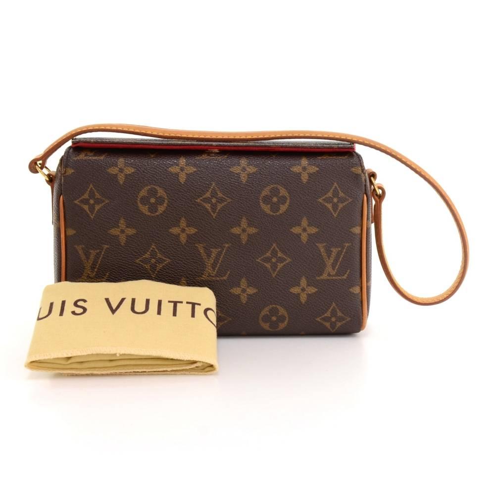 Louis Vuitton Recital handbag in Monogram canvas. It has magnetic closure on top. Inside has red alkantara lining with 1 open pocket. Very cute with any outfit.

Made in: France
Serial Number: MI0084
Size: 7.9 x 5.1 x 2.6 inches or 20 x 13 x 6.5