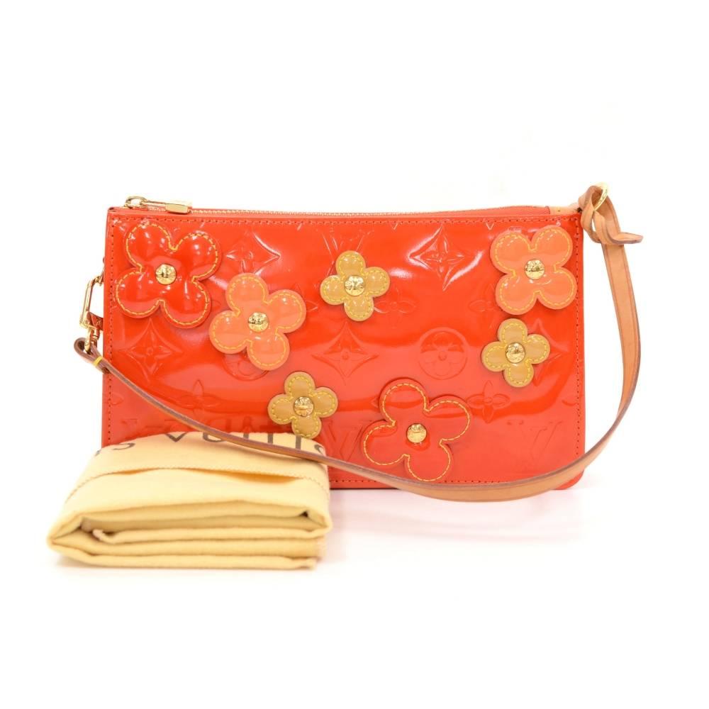 Louis Vuitton Lexington in red vernis leather with flowers. This is a limited edition which was introduced in the year 2001 and it is hard to get.  

Made in: France
Serial Number: V I 0052
Size: 7.9 x 4.5 x 1.6 inches or 20 x 11.5 x 4