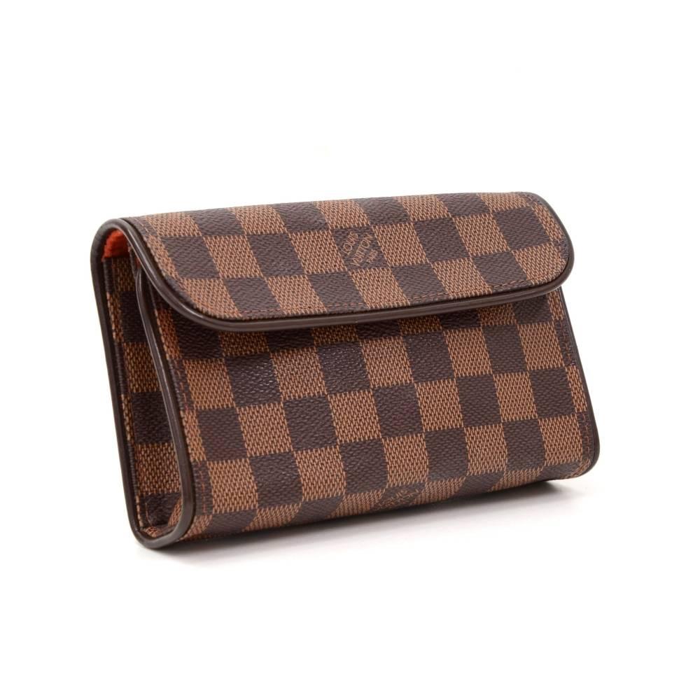 Louis Vuitton Florentine Pochette in damier canvas. With its magnetic closure flap, the Florentine pouch is as practical as it is elegant.   

Made in: France
Serial Number: F L 1 0 0 3
Size: 6.7 x 4.1 x 1.6 inches or 17 x 10.5 x 4 cm
Color: