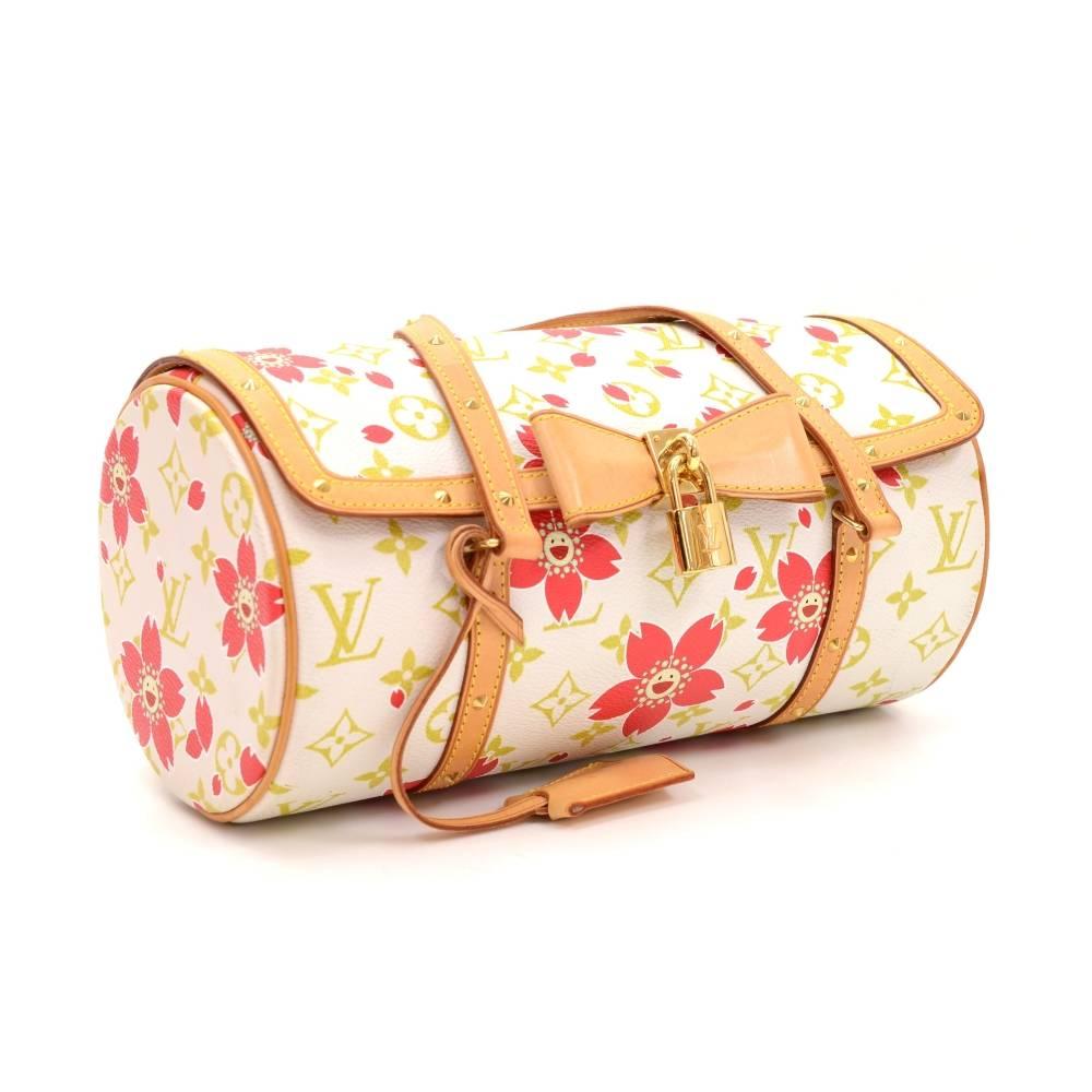 Louis Vuitton Papillon 26 in monogram cherry blossom motif is limited edition from 2003. This gorgeous handbag is crafted from monogram canvas, accented with leather handles. Centered bow with golden lock and trimmed with golden studs. Very cute