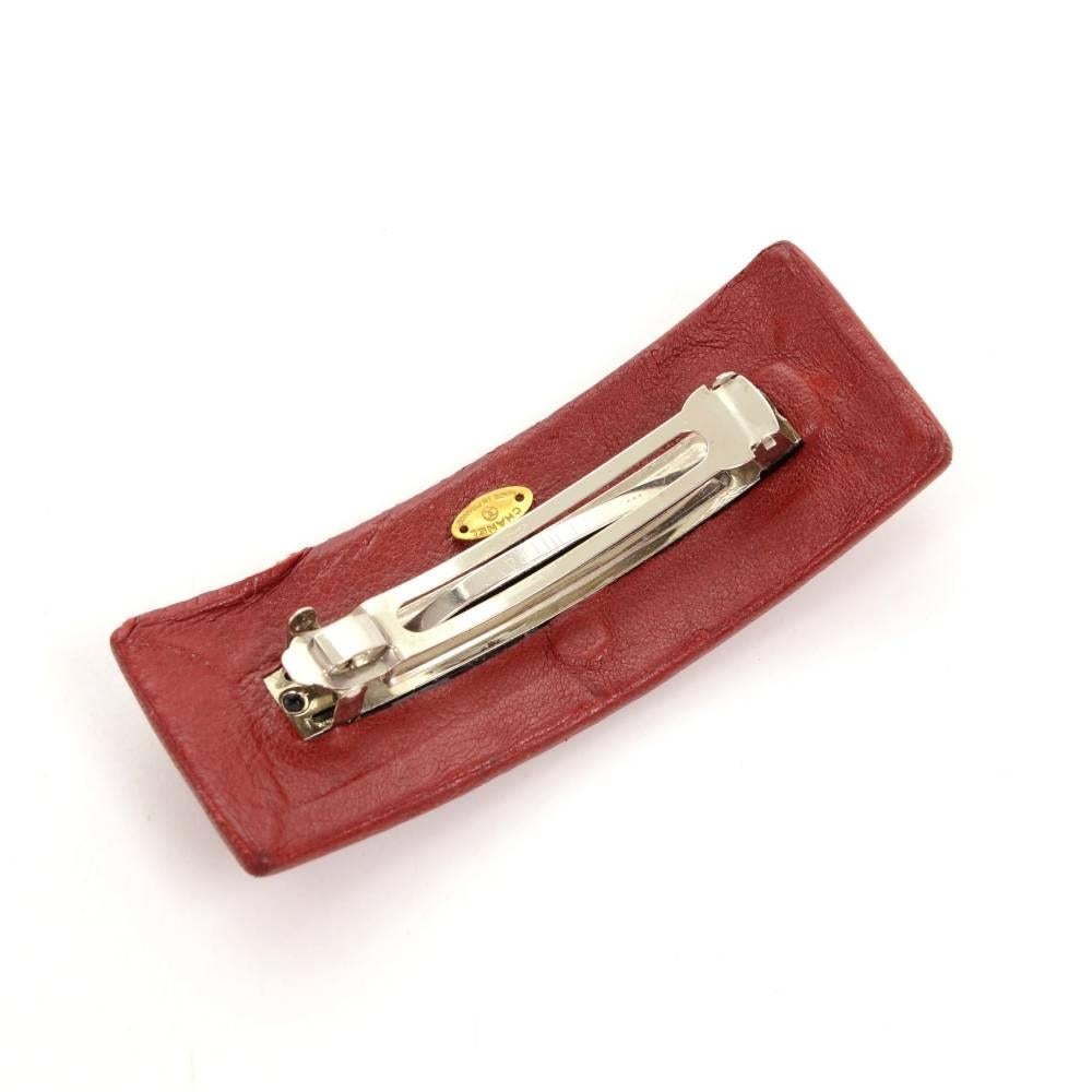 Chanel hair clip. It has large gold tone CC on top of red leather. On the back is engraved Chanel CC Made in France. It can be used daily and is very stylish. Very rare item to find. 

Made in: France
Size: 4.1 x 1.6 x 0 inches or 10.5 x 4 x 0