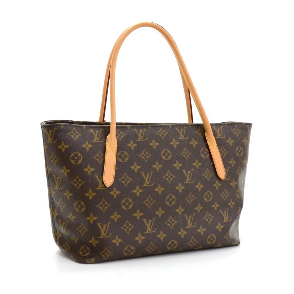 Louis Vuitton Raspail PM tote bag in monogram canvas. Top has zipper closure. Inside has purple lining with 1 open pocket. Great for daily use.

Made in: Spain
Serial Number: CA 2172
Size: 16.1 x 9.1 x 5.1 inches or 41 x 23 x 13 cm
Shoulder