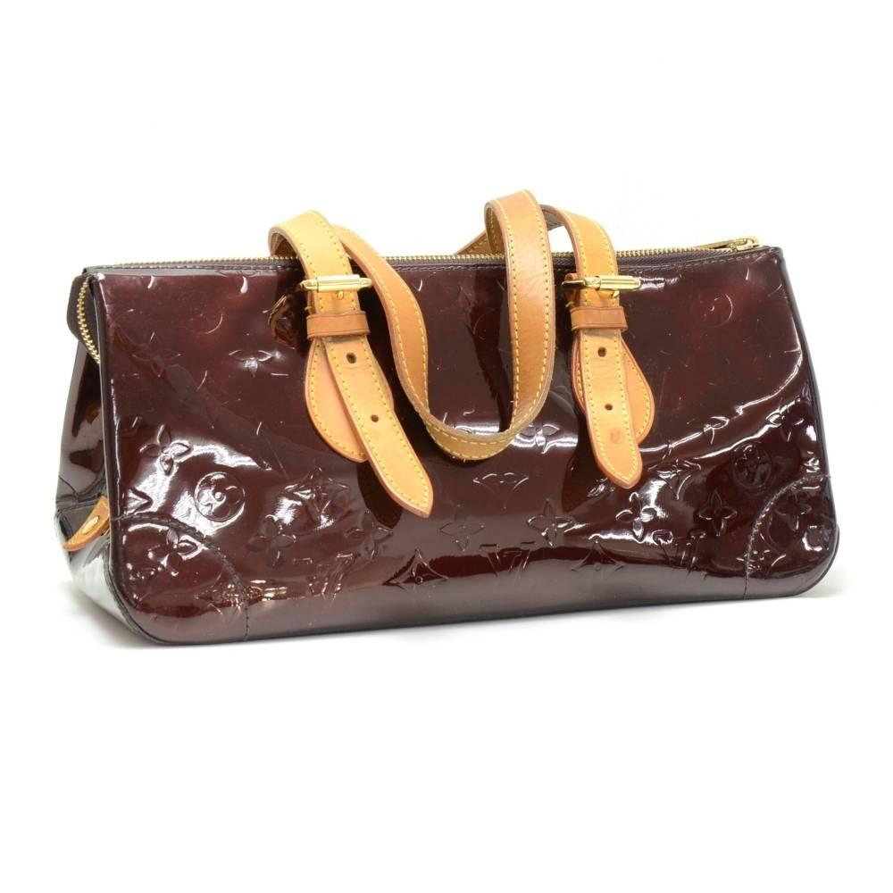 Louis Vuitton Rosewood Avenue shoulder hand bag. Outside has 1 small open pocket. Top is closed with zipper. Inside has matching fabric lining and 1 open pocket. This bag makes a great statement.

Made in: France
Serial Number: F L 1 0 4 7
Size: