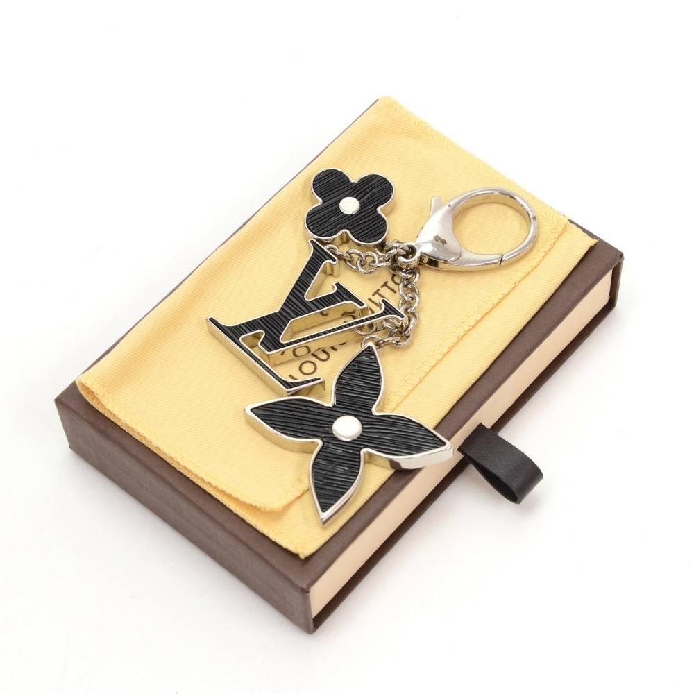 Louis Vuitton Key holder/Bag charm. Rare design would make your keys easy to find. Would as well look great hanging on your bag.

Made in: France
Size: 5.5 x 0 x 0 inches or 14 x 0 x 0 cm
Color: Silver
Dust bag:   Yes included  
Box:   Yes