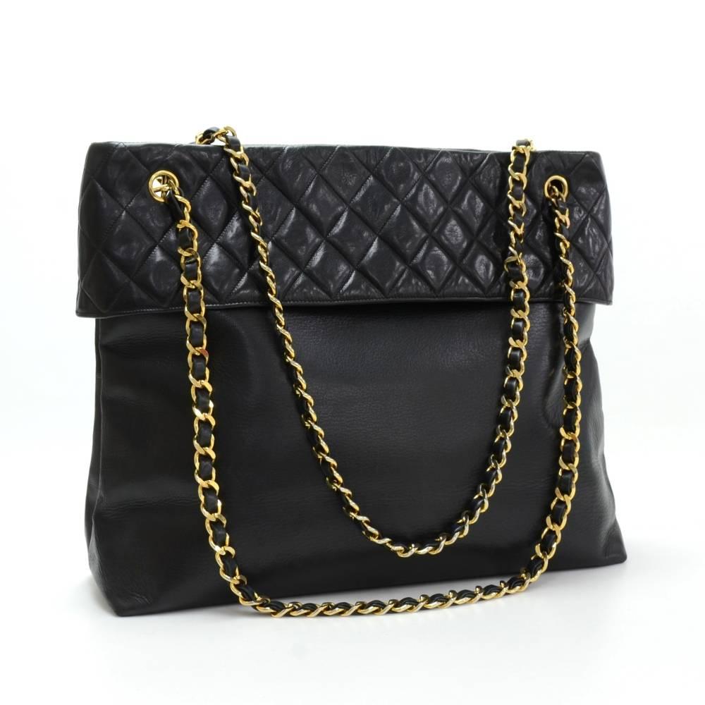 Chanel black quilted leather shoulder bag. It has 2 magnetic closure. Inside has black lining with 1 open and 1 zipper pocket. Comfortably carry on shoulder and offers great capacity. 

Made in: France
Serial Number: 1341506
Size: 14.2 x 12.2 x