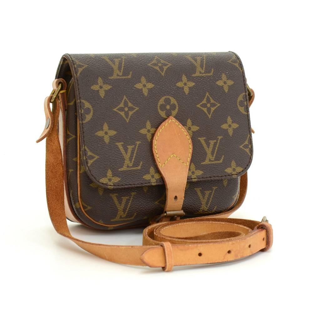 Louis Vuitton Cartouchiere PM in monogram canvas. Flap top secured with belt closure. Inside is brown washable lining. Comfortably carry on shoulder or across body with cowhide leather strap. 

Made in: France
Size: 6.7 x 6.3 x 2 inches or 17 x