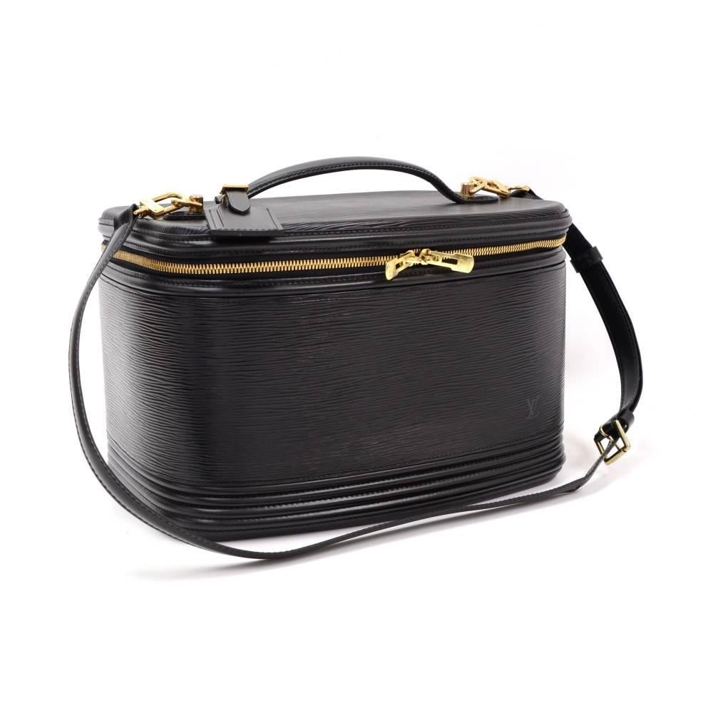 Louis Vuitton Black Vanity cosmetic bag in Epi leather. Top flap closure is secured with double zipper. Inside has a separator to create 2 floors with mirror and leather belt to keep the bottles in standing position. Handheld or carried on shoulder