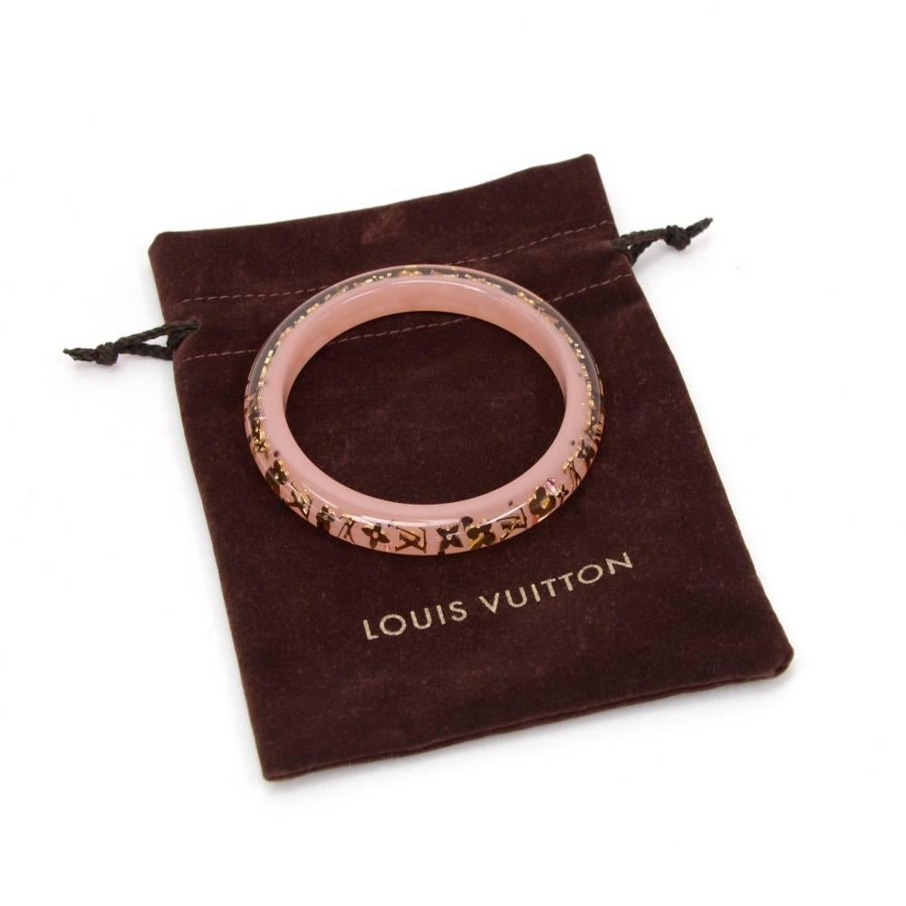 Louis Vuitton bracelet with gold tone monogram designs. Comes in one size only. 

Size: 2.6 x 2.6 x 0.4 inches or 6.5 x 6.5 x 1 cm
Color: Pink
Dust bag:   Yes included  
Box:   Not included  

Condition
Overall: 9 of 10 Excellent pre owned