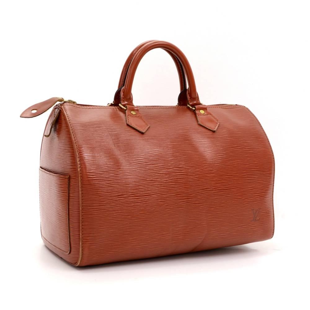 Louis Vuitton Speedy 30 bag in epi leather. Offers lightweight elegance in a compact format. Inspired by the famous keep all travel bag, it has zip closure. Wonderful classic one of the most popular shapes from Louis Vuitton.

Made in: