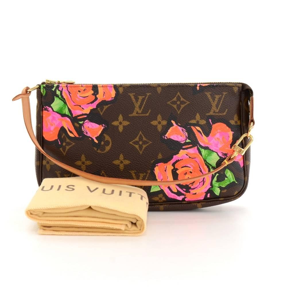  Louis Vuitton Stephen Sprouse Pochette Accessories in rose monogram canvas with cowhide leather strap. It stores beauty products and other daily essentials. Perfect for a night out and parties. It can be either hand-held or linked to the D-ring