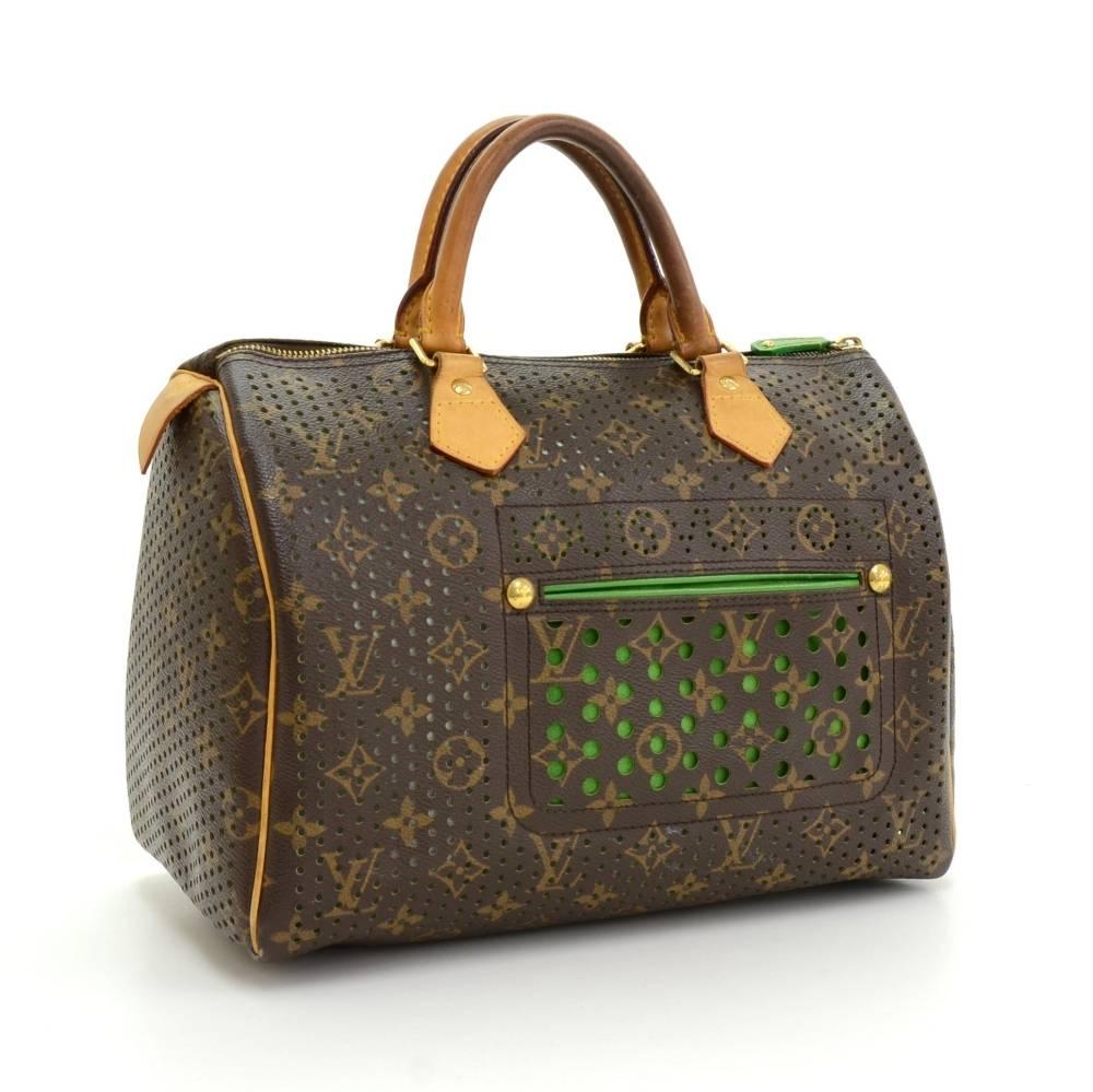 Louis Vuitton Perforated Speedy 30 hand bag crafted in monogram canvas and green leather. This is 2006 limited edition. It offers light weight elegance in a compact format. Inspired by the famous keep all travel bag, it features a brass zip closure.
