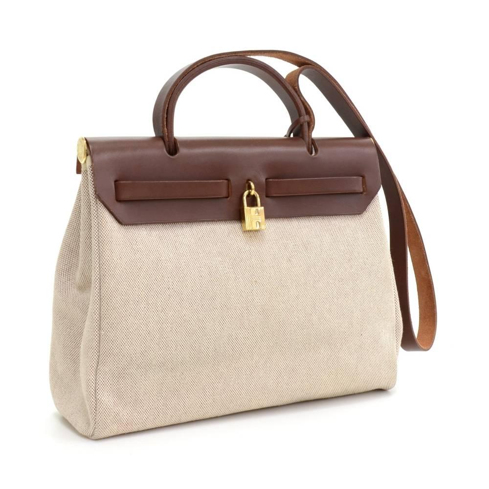 Hermes HerBag PM size 2 in 1. Two canvas bags with leather. Leather pieces can be attached to both bags so you can enjoy different looks. Shoulder strap is removable. Very stylish bag.  Small Canvas bag: App 11.8 x 9.1 x 4.7 inches or 30 x 23 x 12