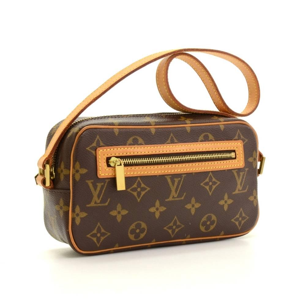 Louis Vuitton Pochette Cite Bag in monogram canvas. It has zipper closure and 1 exterior zipper pocket. Inside has 1 open pocket and brown lining.

Made in: France
Serial Number: D U 0 0 6 3
Size: 8.5 x 4.9 x 2.6 inches or 21.5 x 12.5 x 6.5