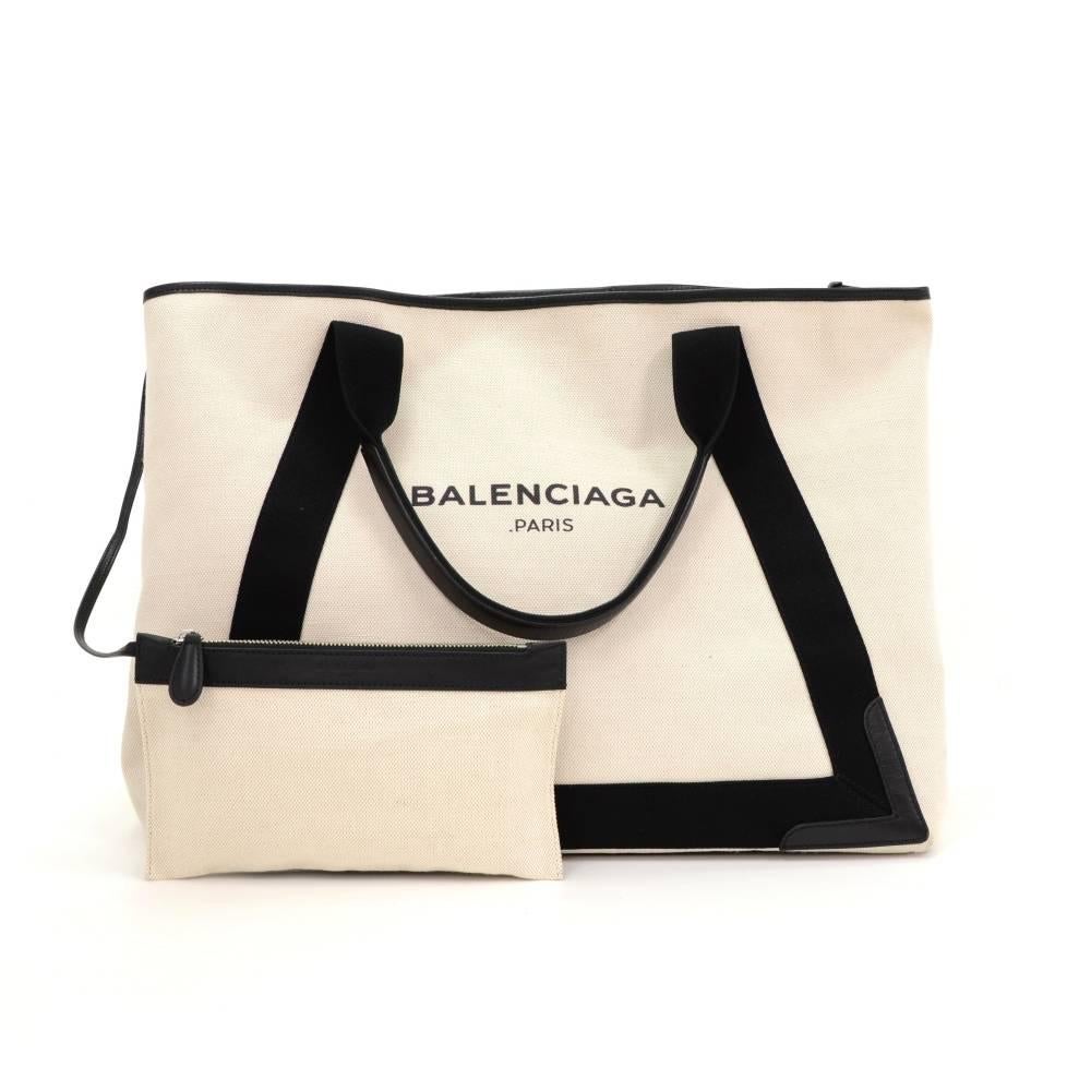 Balenciage Tote Bag in black and white canvas. Open access with attached small pouch inside. This stunning bag offers great capacity and easy access. Perfect for daily use

Made in: Italy
Serial Number: 339936.1065.F.002123
Size: 16.5 x 12.6 x