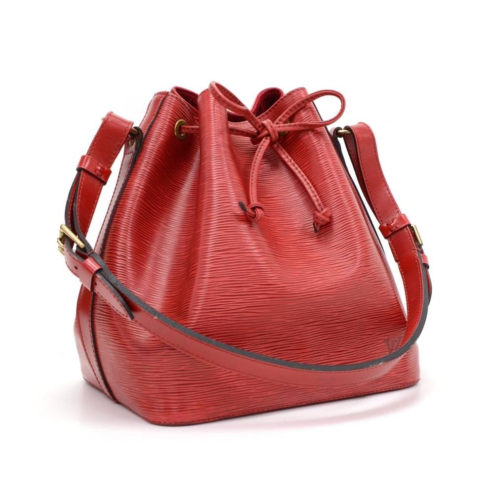 Louis Vuitton Petit Noe a smaller-scale interpretation of the famous champagne bag created in 1932. Petit Noé is styled in Epi leather. Leather strap closure, adjustable shoulder strap. Comfortably carried on one shoulder or in hand. Perfect for