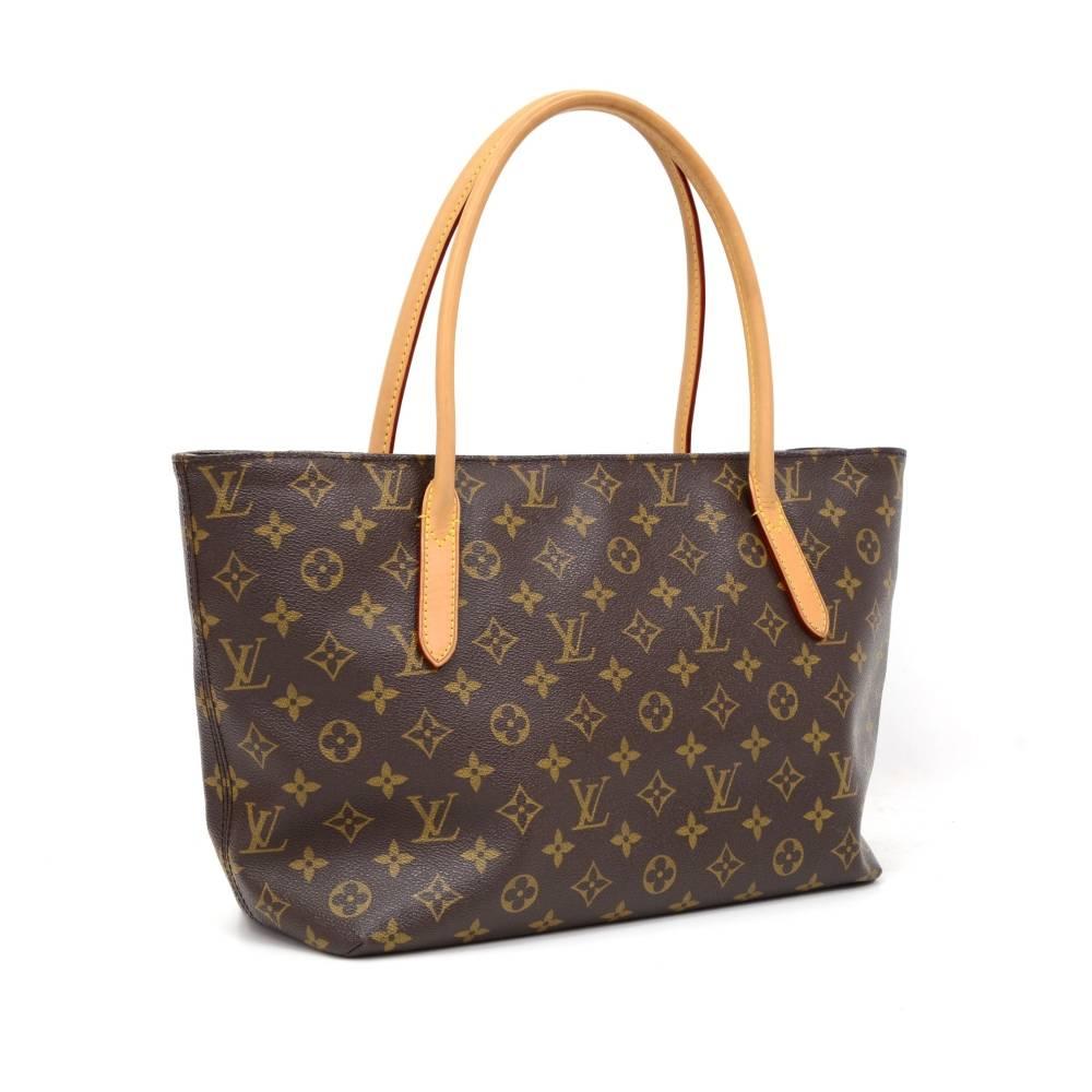 Louis Vuitton Raspail PM tote bag in monogram canvas. Top has zipper closure. Inside has purple lining with 1 open pocket. Great for daily use.

Made in: Spain
Serial Number: CA 2112
Size: 16.1 x 9.1 x 5.1 inches or 41 x 23 x 13 cm
Shoulder