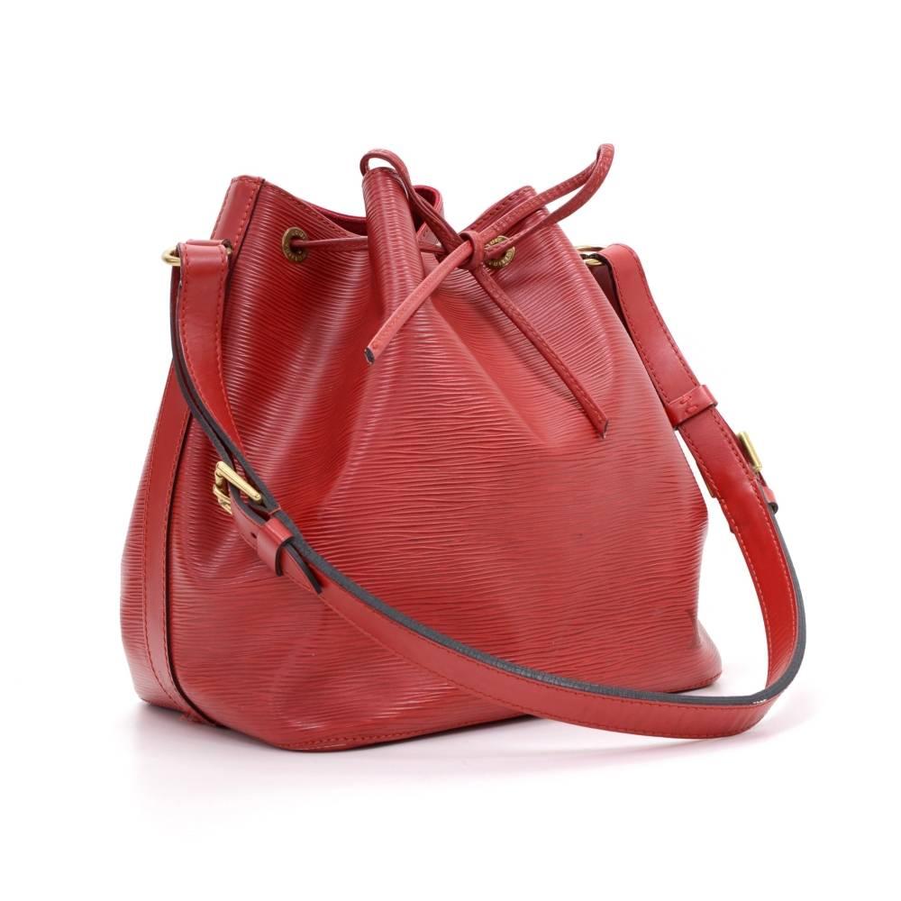 Louis Vuitton Petit Noe a smaller-scale interpretation of the famous champagne bag created in 1932. Petit Noé is styled in Epi leather. Leather strap closure, adjustable shoulder strap. Comfortably carried on one shoulder or in hand. Perfect for