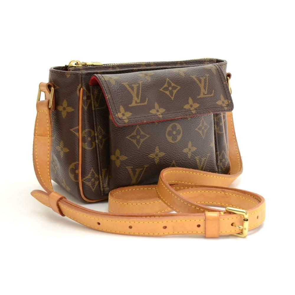 Louis Vuitton Viva Cite bag in monogram canvas. Outside has 1 flap pocket with magnetic closures. Main access is secured with zipper. Inside has red alkantra lining. Comfortably carry on shoulder or across the body with cowhide adjustable shoulder