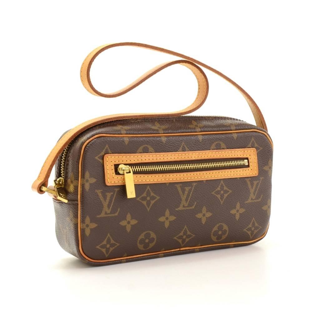 Louis Vuitton Pochette Cite Bag in monogram canvas. It has zipper closure and 1 exterior zipper pocket. Inside has 1 open pocket and brown lining.

Made in: France
Serial Number: MI0032
Size: 8.5 x 4.9 x 2.6 inches or 21.5 x 12.5 x 6.5 cm
Shoulder