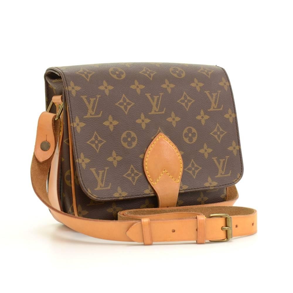 Louis Vuitton Cartouchiere MM in monogram canvas. Flap top secured with belt closure. Inside is brown washable lining. Comfortably carry on shoulder or across body with cowhide leather strap. 

Made in: France
Serial Number: SL 8920
Size: 8.3 x 7.1