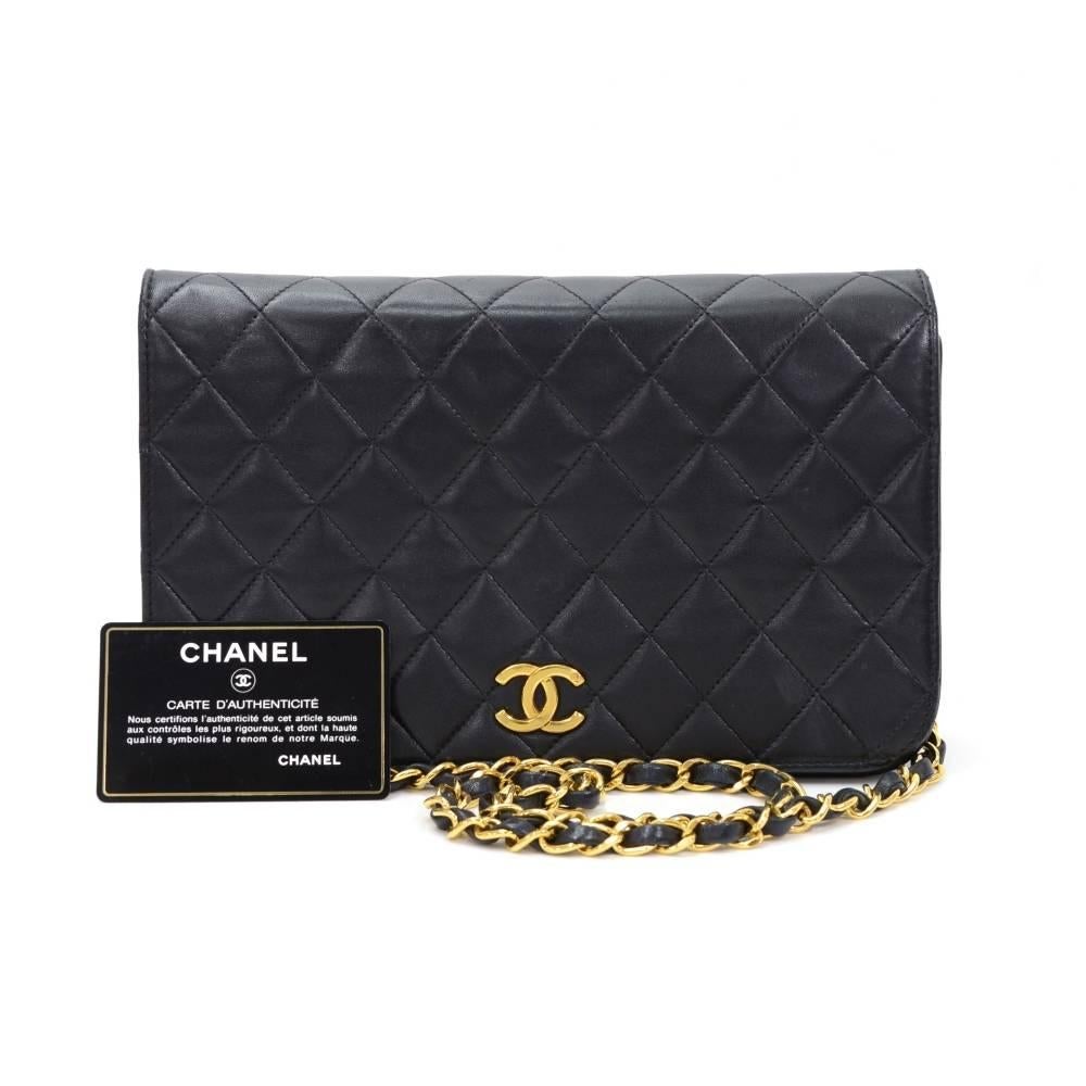 Chanel Black leather quilted shoulder bag. It has a flap with famous CC stud closure on the front. Inside has Chanel red leather lining with 1 zipper pocket and 1 open pocket splitted into 3 compartments. It can be carried on shoulder or across
