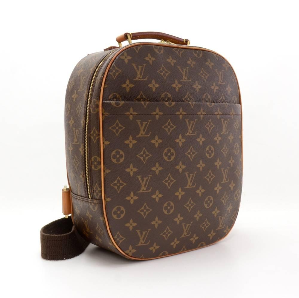 Louis Vuitton Sac a Dos Packall shoulder bag. It has 1 zipper pocket on the front. Top secured with double zipper. Inside has 1 open pocket, 1 for mobile or glass, 2 holders for pen and 1 for card/business card. Great companion wherever you