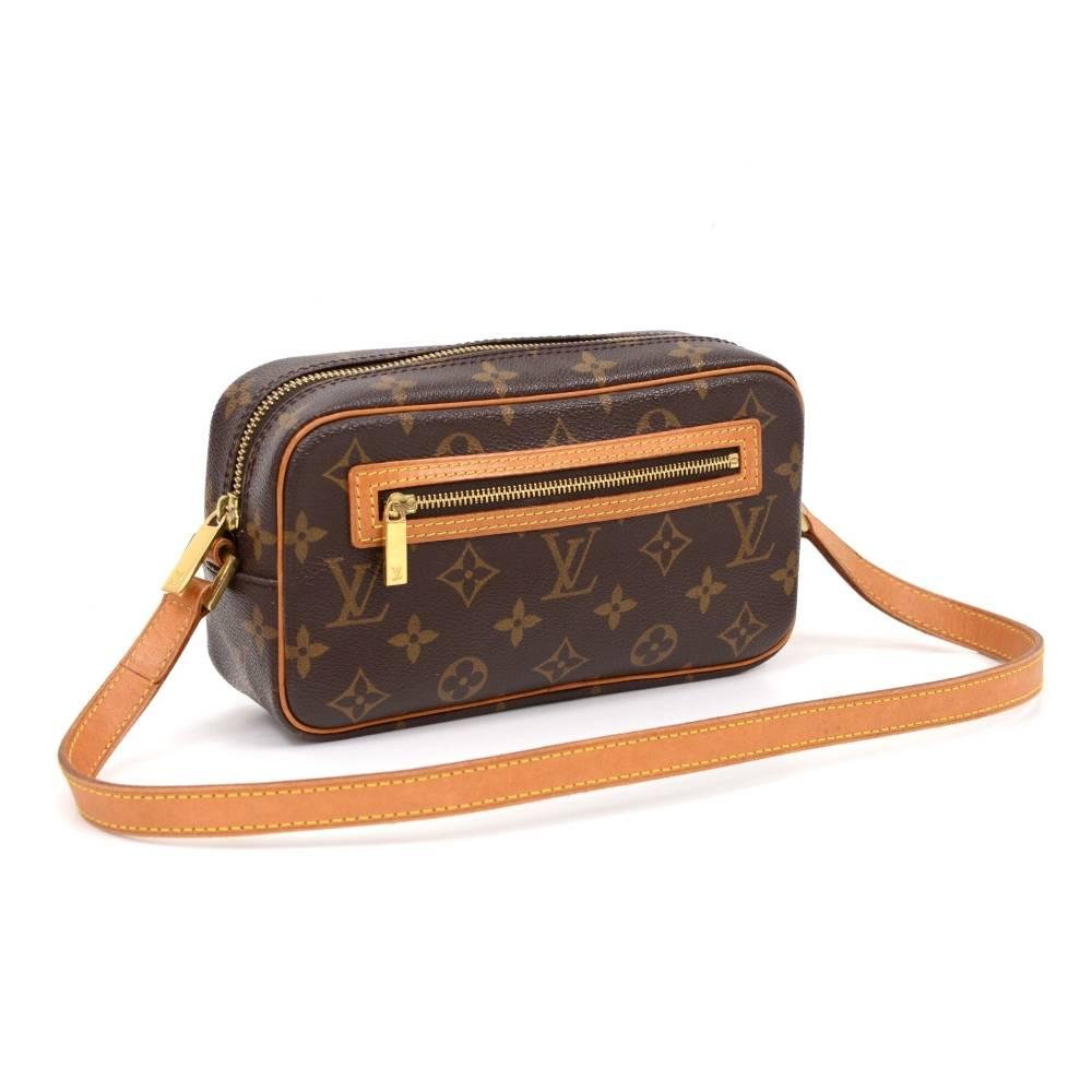 Louis Vuitton Pochette Cite Bag in monogram canvas. It has zipper closure and 1 exterior zipper pocket. Inside has 1 open pocket and brown lining.

Made in: France
Serial Number: MI0042
Size: 8.5 x 4.9 x 2.6 inches or 21.5 x 12.5 x 6.5 cm
Shoulder
