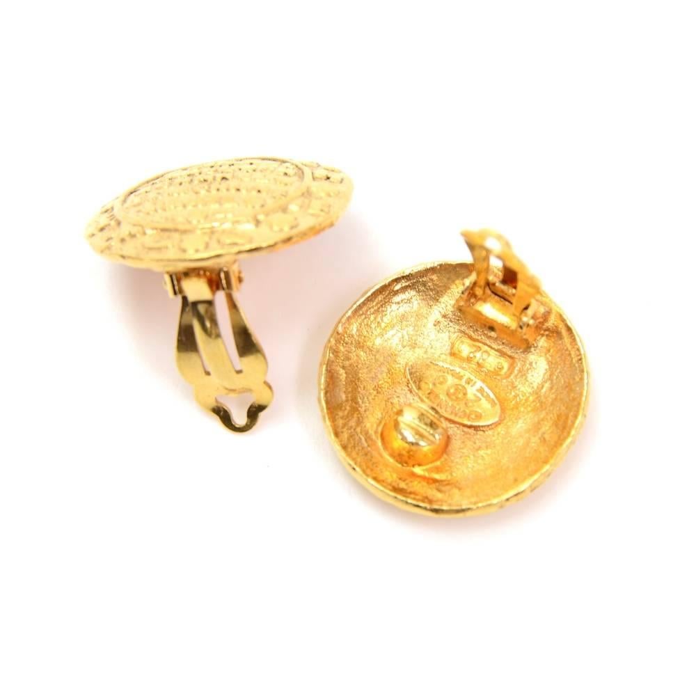 Chanel gold tone earrings. CHANEL 2 CC 8 Made in France 821 engraved on the back. They look truly wonderful and have easy and secure clip to put them on! 

Made in: France
Size: 1 x 1 x 0 inches or 2.5 x 2.5 x 0 cm
Color: Gold
Dust bag:   Not