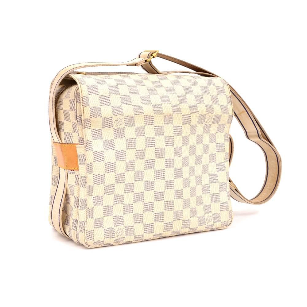 Louis Vuitton Naviglio messenger/shoulder bag in white Damier Azur Canvas. It has flap with two stud closure and double zipper. Inside is in beige canvas lining with 1 open pocket. Can be used as shoulder or messenger bag and offer great capacity.