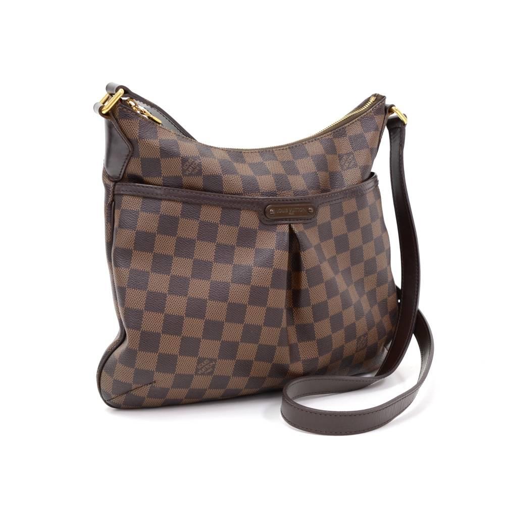 Louis Vuitton Bloomsbury PM shoulder bag in brown Damier canvas. Top is secured with zipper and 1 slip pocket with stud closure on front. Inside is in red lining with 1 open pocket and 1 pocket for mobile or glasses. Comfortably carried on shoulder
