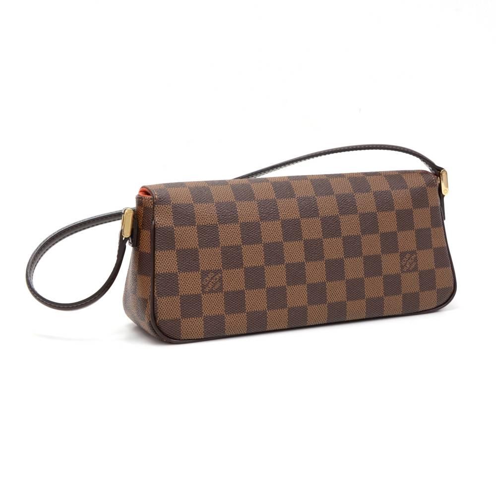Louis Vuitton Recoleta hand bag in brown Damier canvas. It has flap with magnetic closure. Inside has red alkantra lining with 1 open pocket. It stores beauty products and other daily essentials. Stay organized in style!

Made in: France
Serial