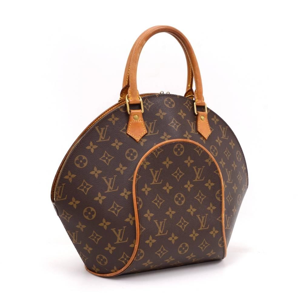 Louis Vuitton Ellipse MM in monogram canvas. Easy access secured with double zipper and spacious interior for all your goods. Inside is one open pocket and brown lining. Discontinued item in unique shape. 
Serial Number: MI0998
Size: 15 x 11.8 x 5.9