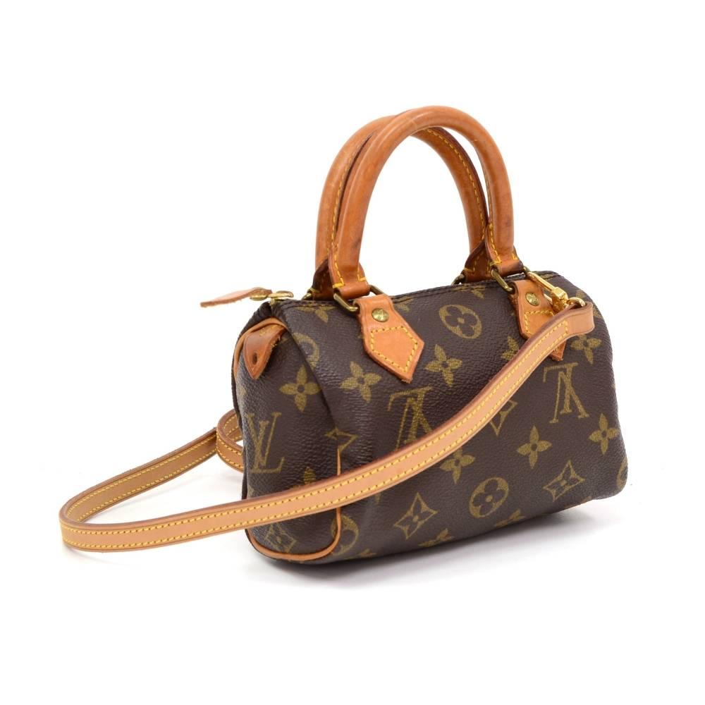 Louis Vuitton handbag Mini Speedy Sac HL, one of the most popular line in LV monogram canvas. Brass zipper securing access. Inside is brown lining. Very cute item to have. 

Made in: France
Serial Number: T H 0 9 6 2
Size: 5.9 x 3.9 x 2.8 inches or