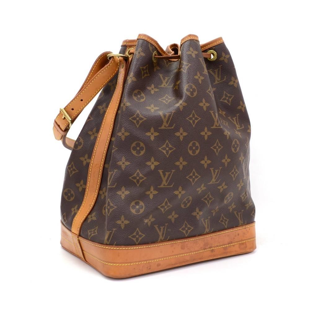 Louis Vuitton Noe shoulder bag. It has adjustable shoulder strap and tie up string closure. Inside is brown lining. The famous champagne bag created in 1932 which makes it a true classic.

Made in: France
Serial Number: AR0945
Size: 10.2 x 13.4 x