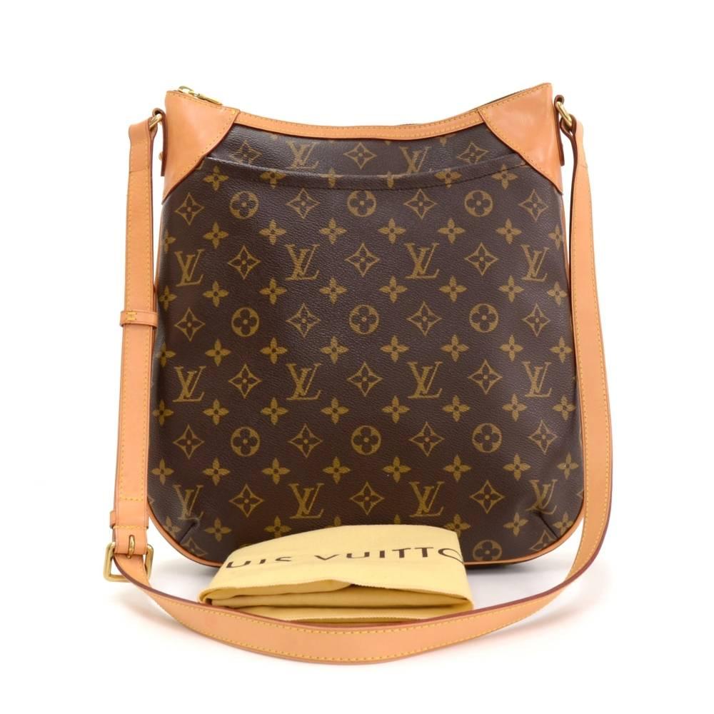 Louis Vuitton Odeon MM shoulder bag. Outside has open slip pocket in front. Top with zipper closure. Inside has brown lining and has 2 pockets: 1 open and 1 for mobile. Adjustable leather strap could be worn on one shoulder. Excellent for everyday