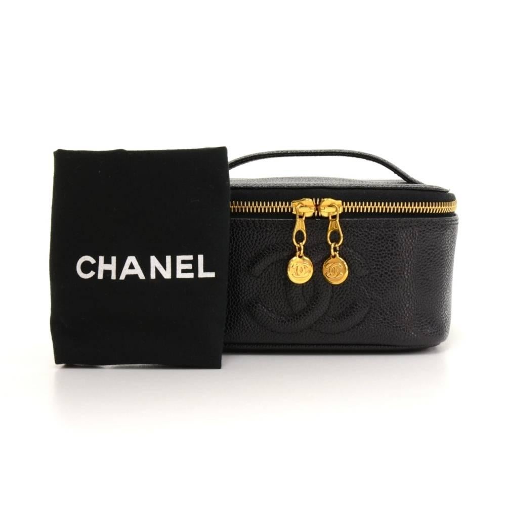 Chanel black caviar leather vanity cosmetic bag. Top secured with double zipper. Inside has black leather lining with rubbers to keep things organized. Can be carried in hand and look so cute.

Made in: Italy
Serial Number: 4942167
Size: 6.3 x 6.3 x