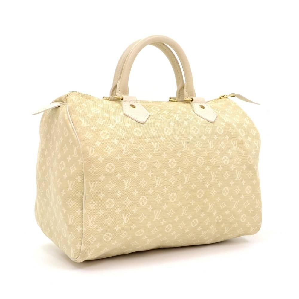 Louis Vuitton Speedy 30 bag in mini line canvas. It offers light weight elegance in a compact format. Inspired by the famous keep all travel bag, it features a zip closure. This hand held bag is perfect for carrying everyday essentials.

Made in: